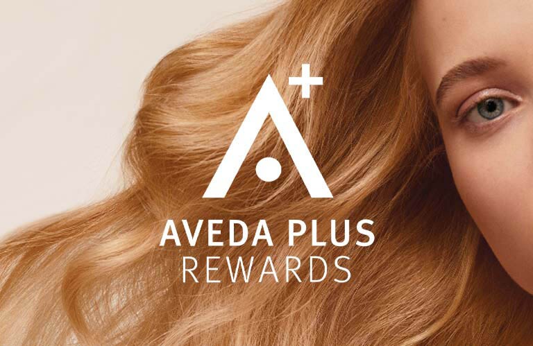 AVEDA PLUS REWARDS logo overlayed on image of Aveda hair care model.
