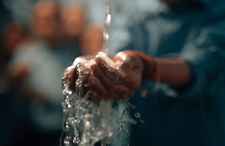 Approved charity: water imagery.